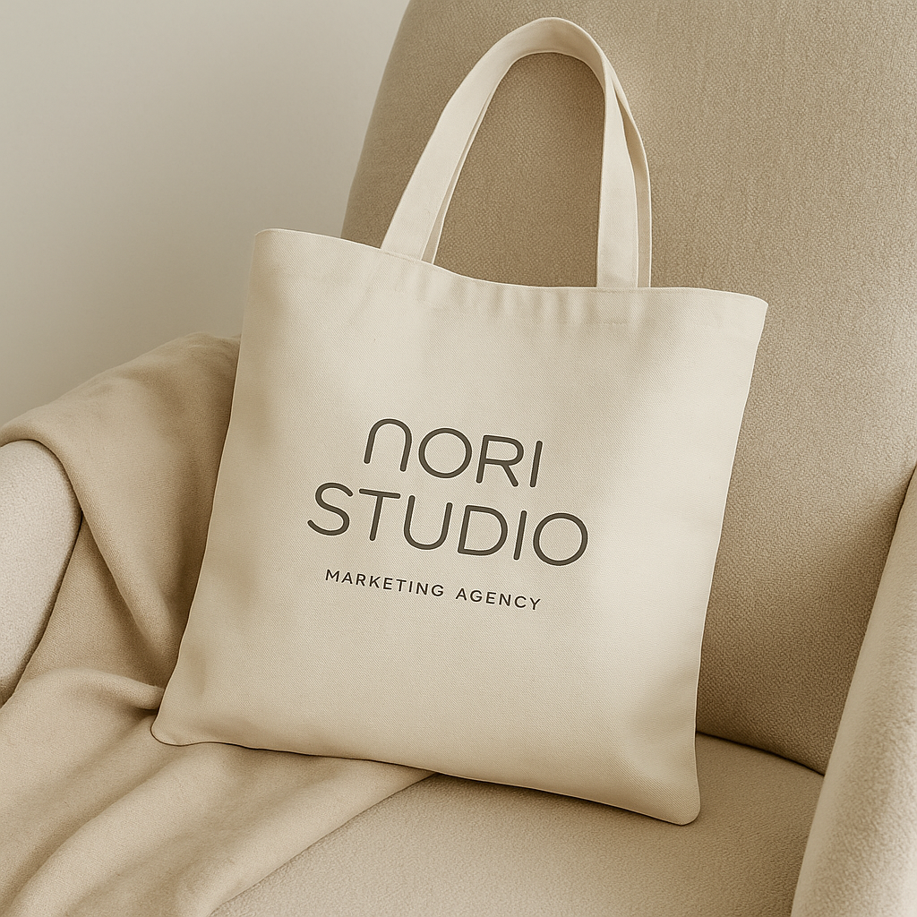 Cream color canvas bag  on a couch for Nori Studio Marketing Agency